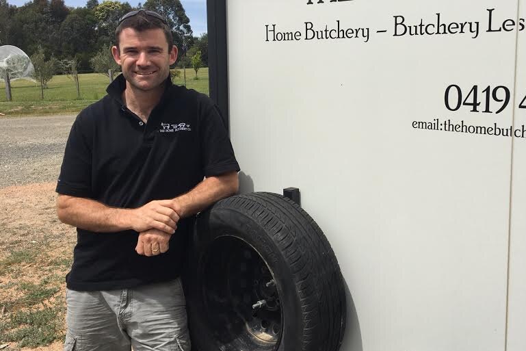 Mobile butcher Damien Filtness stands in front of his van on his Bruthen property.
