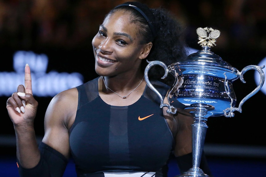 Serena Williams holds the trophy after winning the Australian Open final in 2017