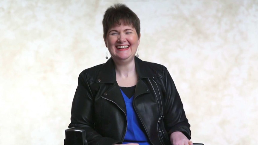 Domestic and family abuse survivor Anj Barker smiling at the camera