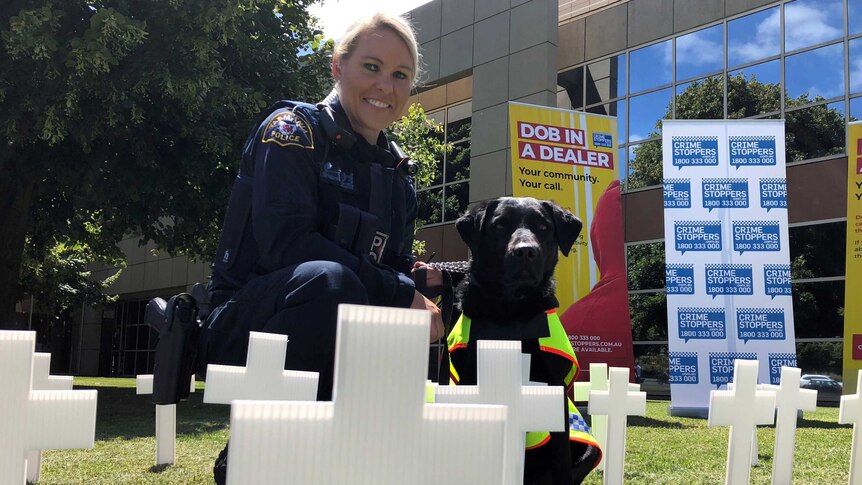 Senior Constable Anne-Marie Bennett, with sniffer dog Aggie.