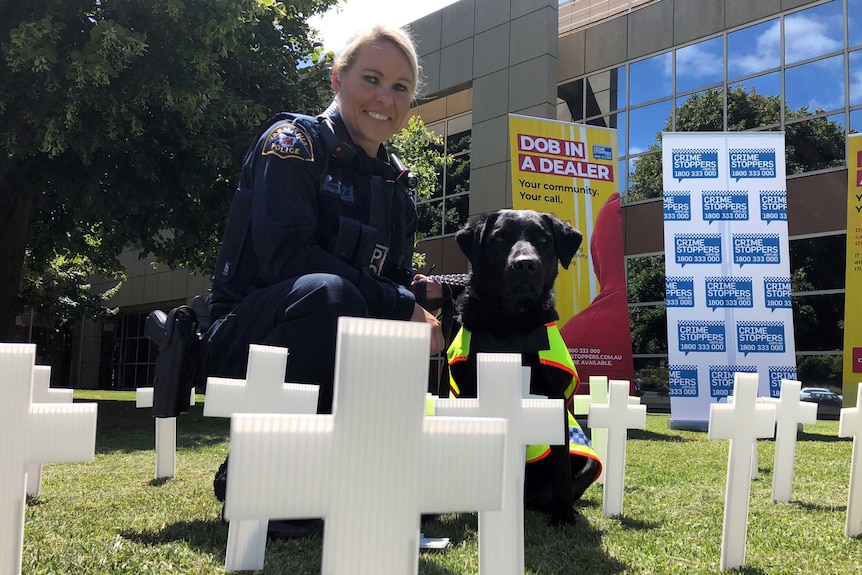 Senior Constable Anne-Marie Bennett, with sniffer dog Aggie.
