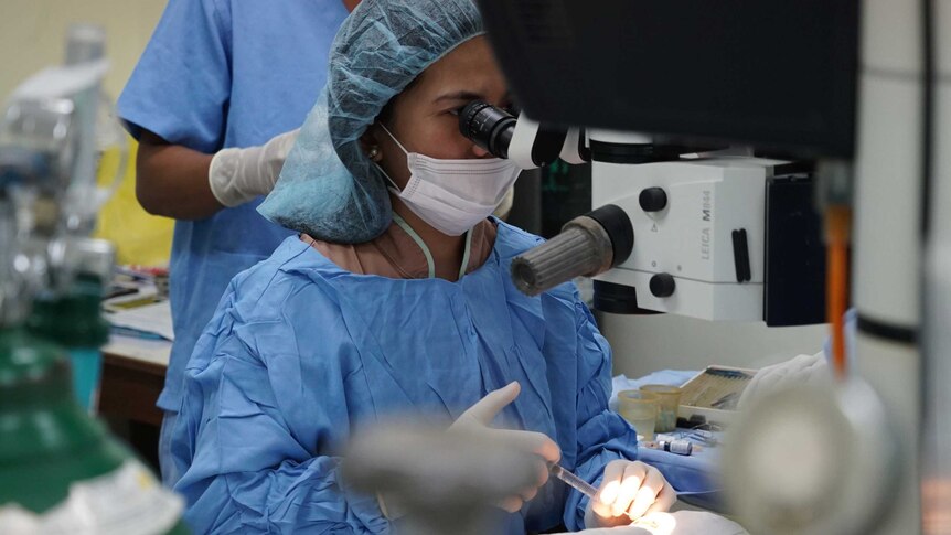 A surgeon operates during cataract surgery