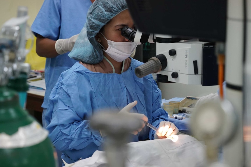 A surgeon operates during cataract surgery in the Philippines