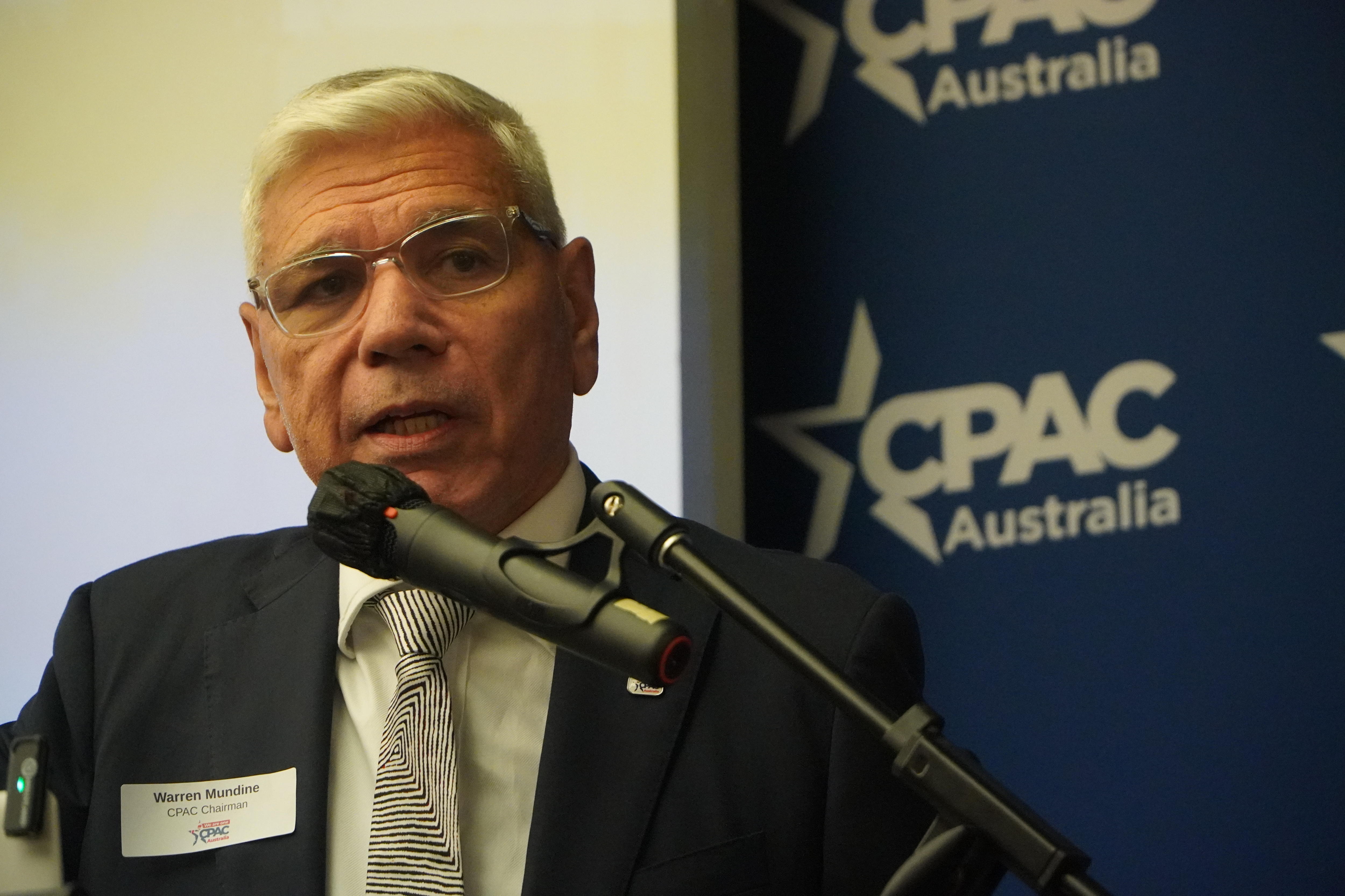 Warren Mundine speaks into a microphone