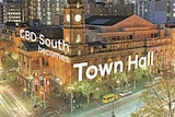 Graphic of the new name for the CBD South station, Town Hall, over a photo of Melbourne's city hall.
