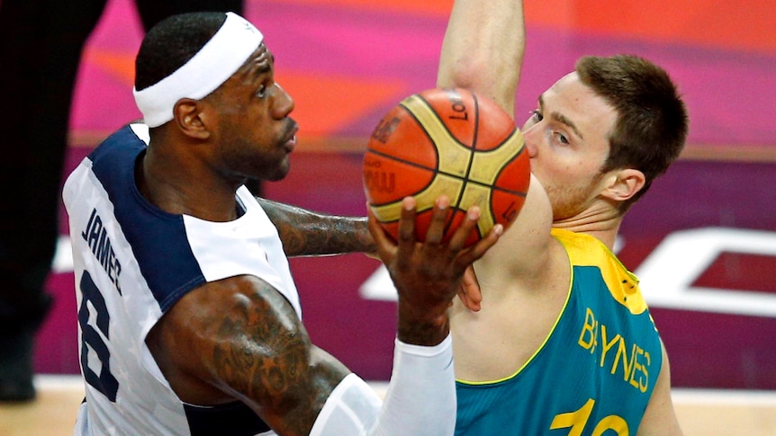 Mixing it with the best ... Aron Baynes (R) presses USA's LeBron James.