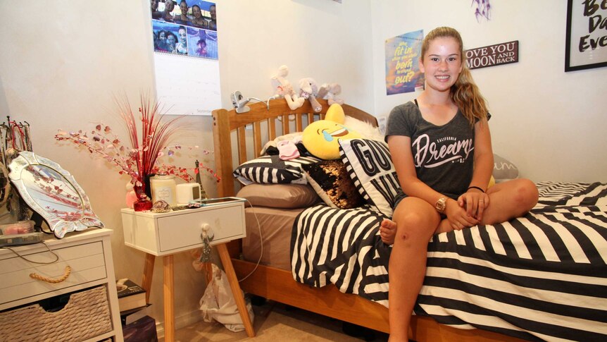 Twelve-year-old Kobe Giles in her bedroom in Karratha, Western Australia.