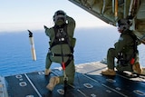 Royal Air Force officers drop data marker buoy into southern Indian Ocean