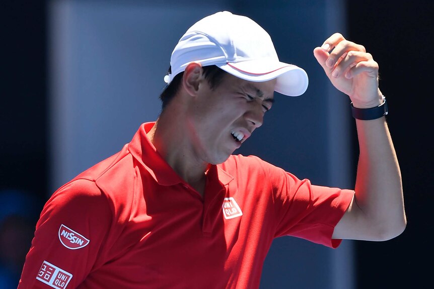 Japan's Kei Nishikori misses a shot against Russia's Andrey Kuznetsov at the Australian Open.