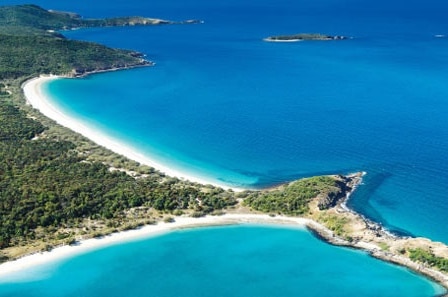 An aerial view of Great Keppel Island, white sand, blue water.