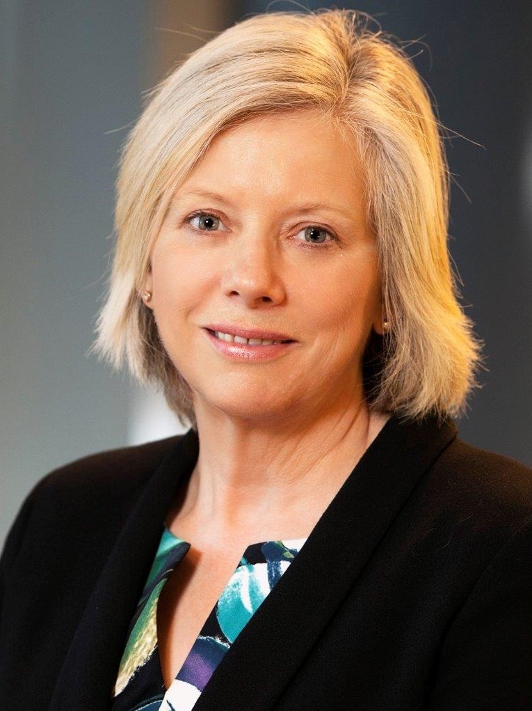 Professional headshot of surf coast shire councillor Heather Wellington who has blonde hair and is wearing  a dark jacket