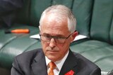 Malcolm Turnbull crosses his arms in parliament