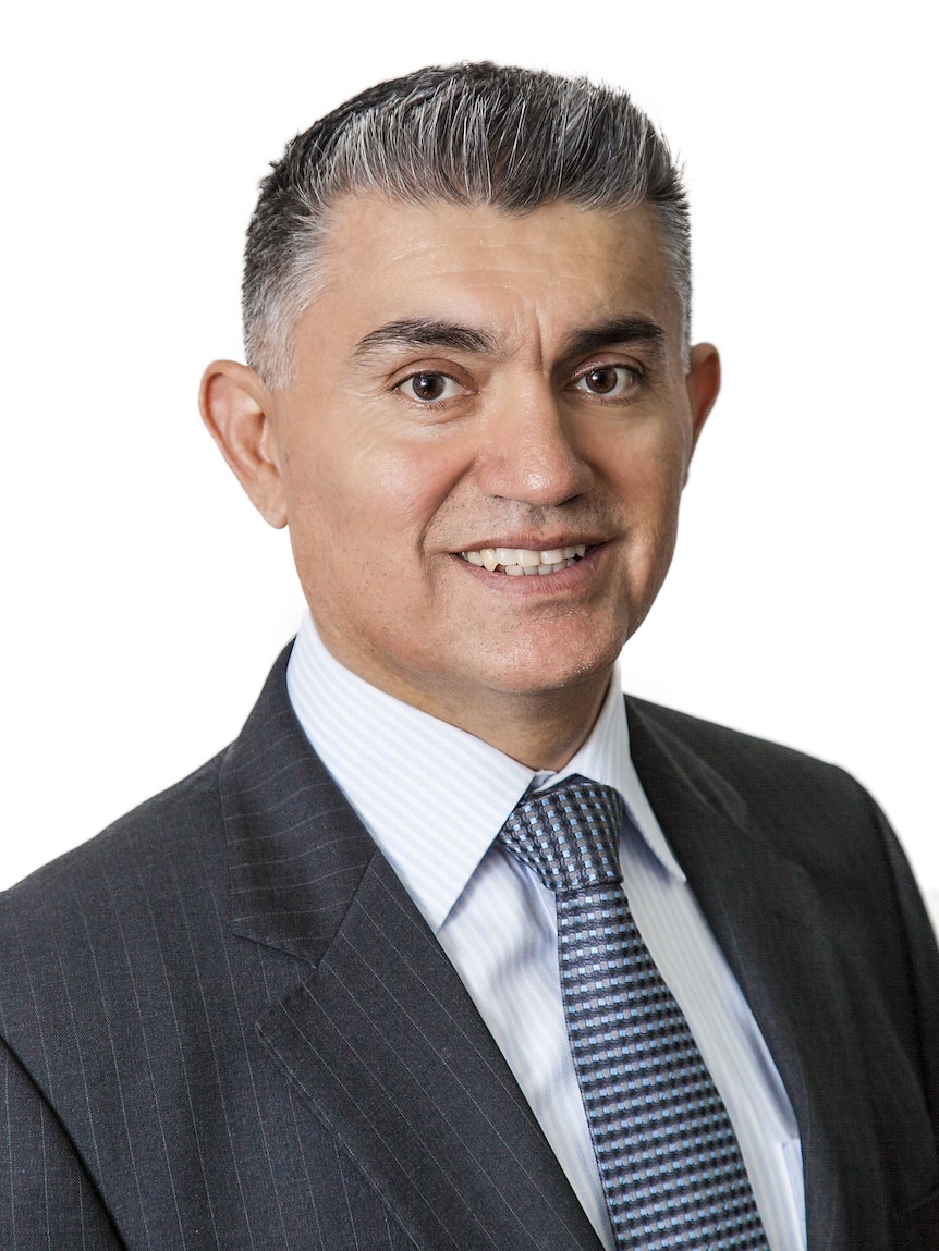 Headshot of Edwin Almeida in front of a white background.