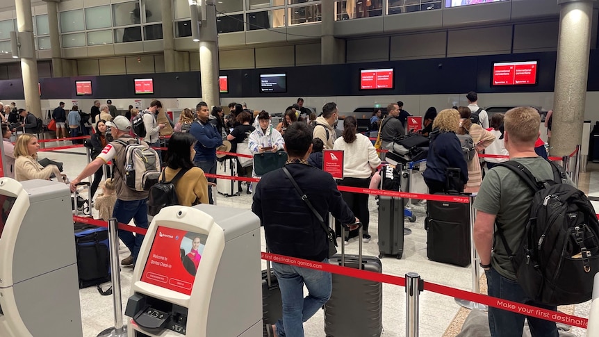 People queue up at Brisbane Airport.