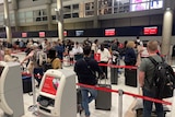 People queue up at Brisbane Airport.