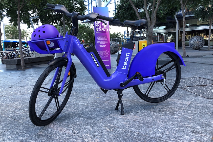 A bright purple Beam e-bike in Brisbane Square