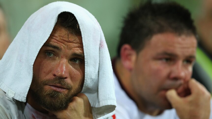 Anthony Watmough and George Rose sit on the sidelines in Manly's loss to Melbourne.