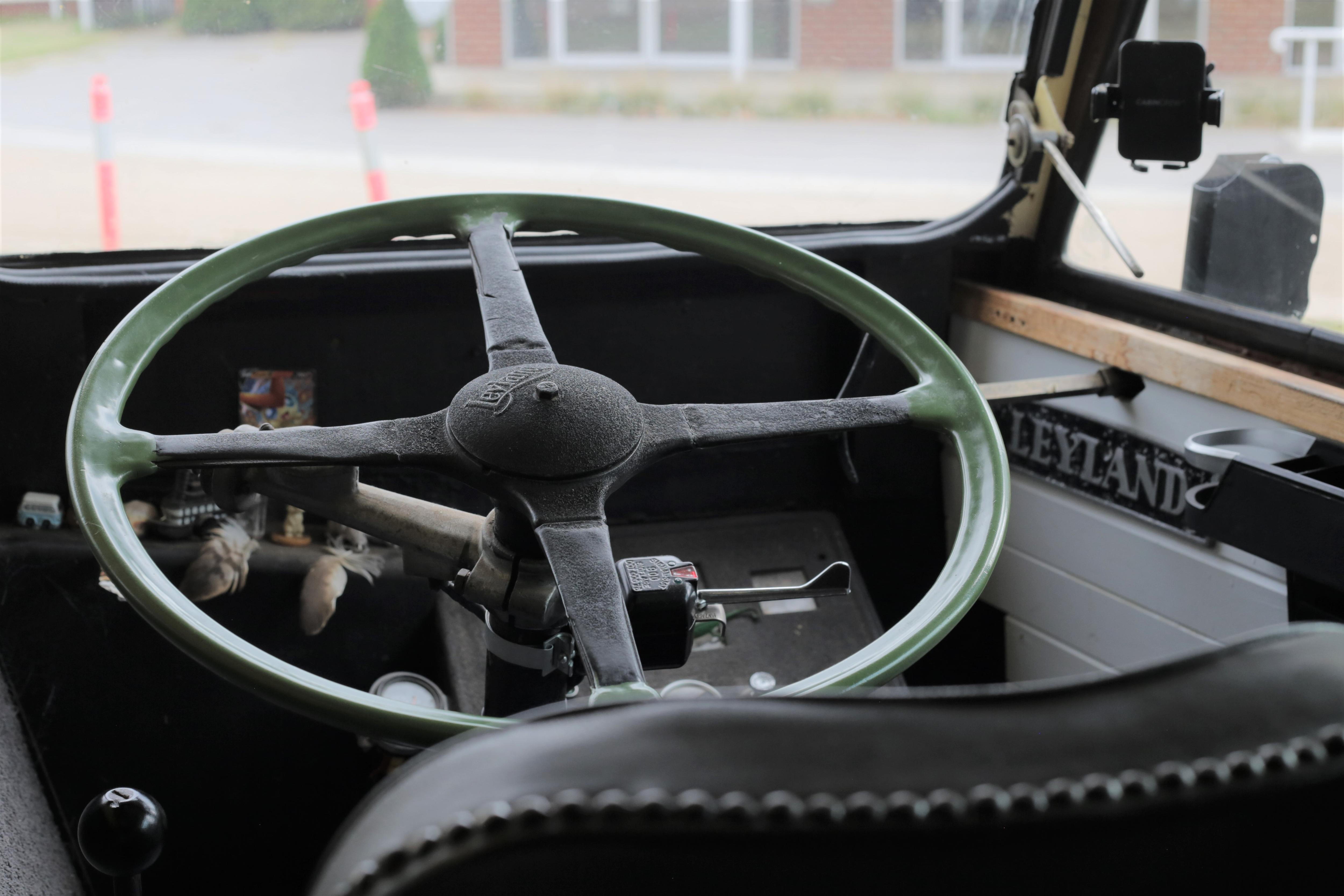 steering wheel of an old  bus.