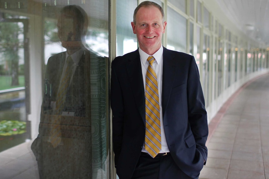 Graham Tuckwell poses for photos at ANU.