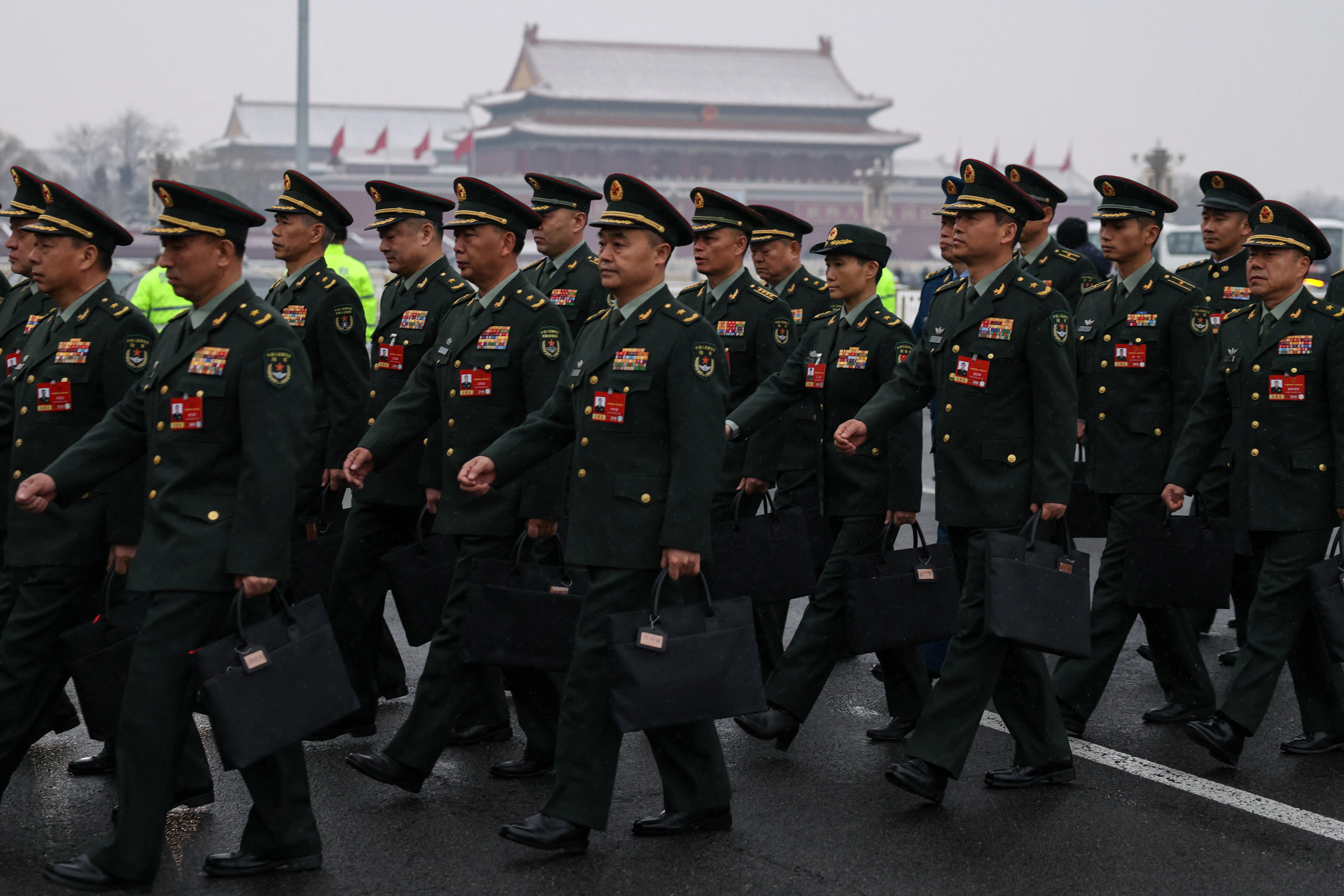 men march in uniform.