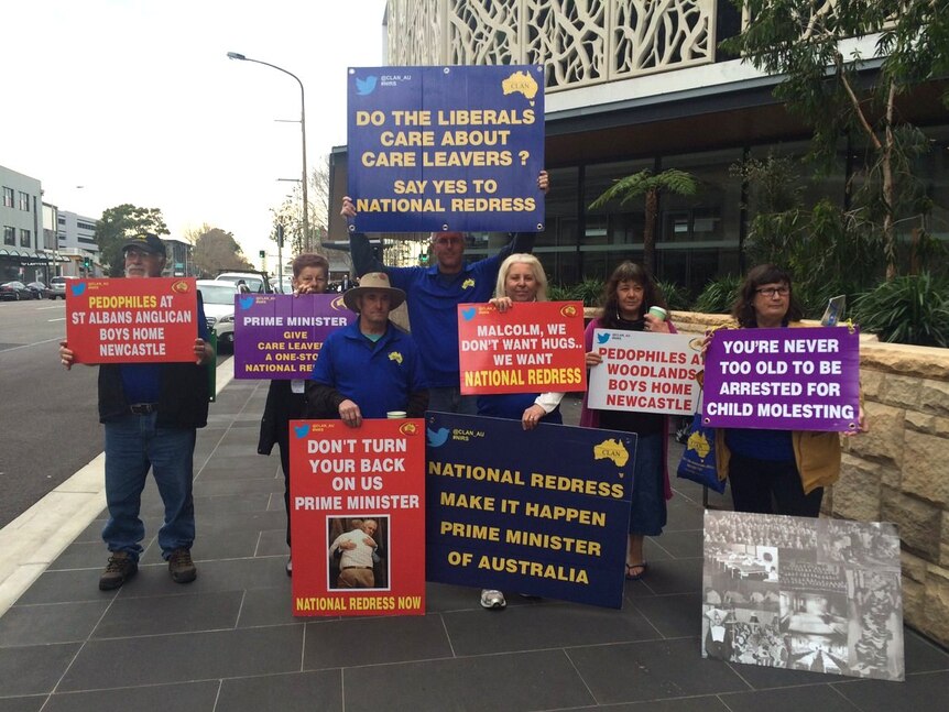 Protesters outside the Royal Commission public hearings into Newcastle's Anglican Diocese.