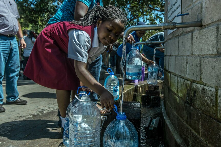 Cape Town residents queue to refill water bottles