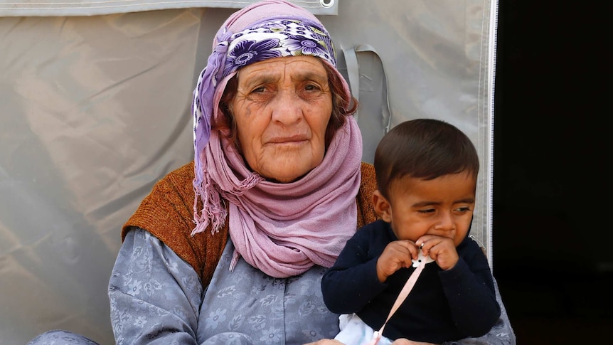 Kurdish refugees from the Syrian town of Kobane are seen in a camp in the south-eastern town of Suruc.