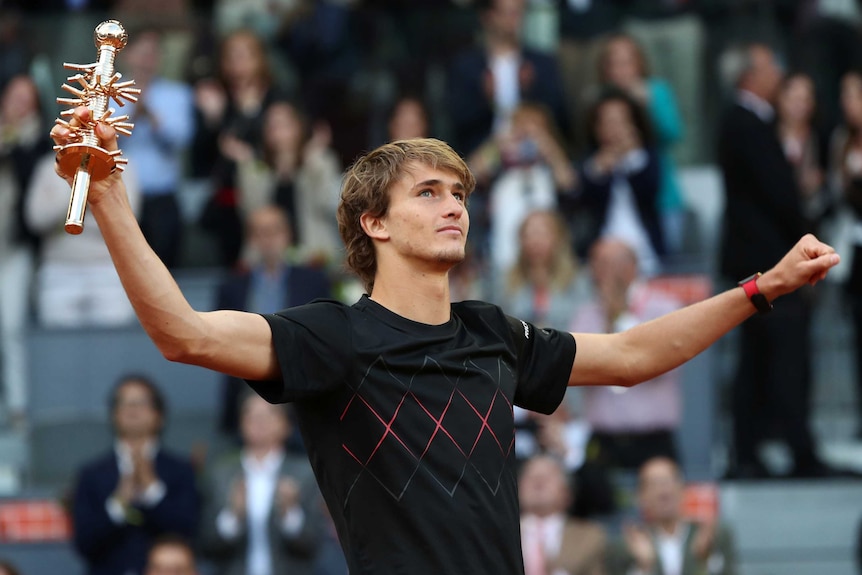 Alex Zverev celebrates with Madrid Open trophy