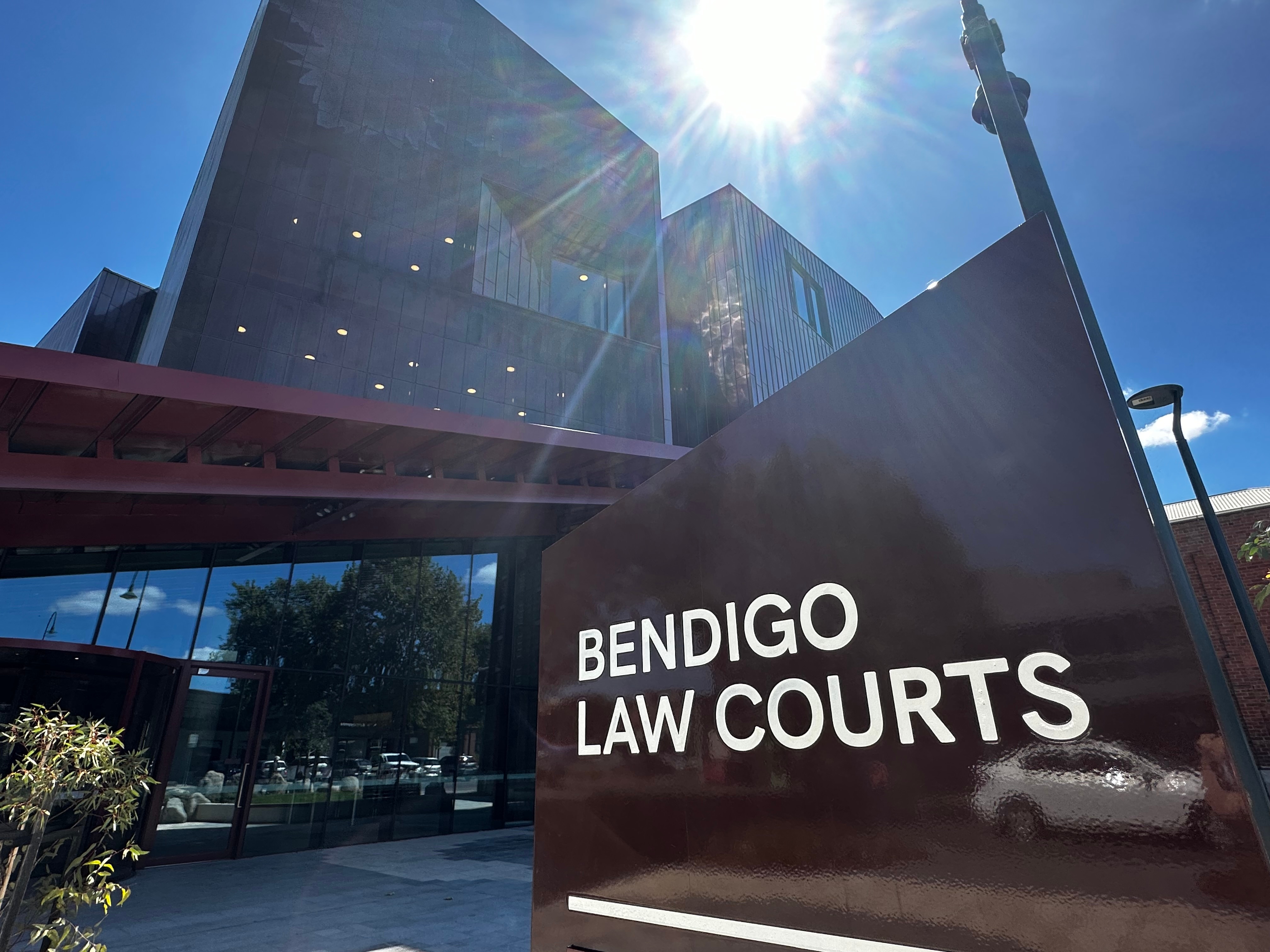 photo of sign to new Bendigo Courthouse on a sunny day