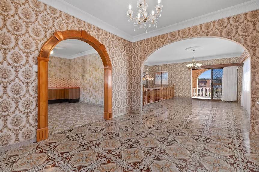 Upstairs living area with ornate marble tiling leading out to balcony