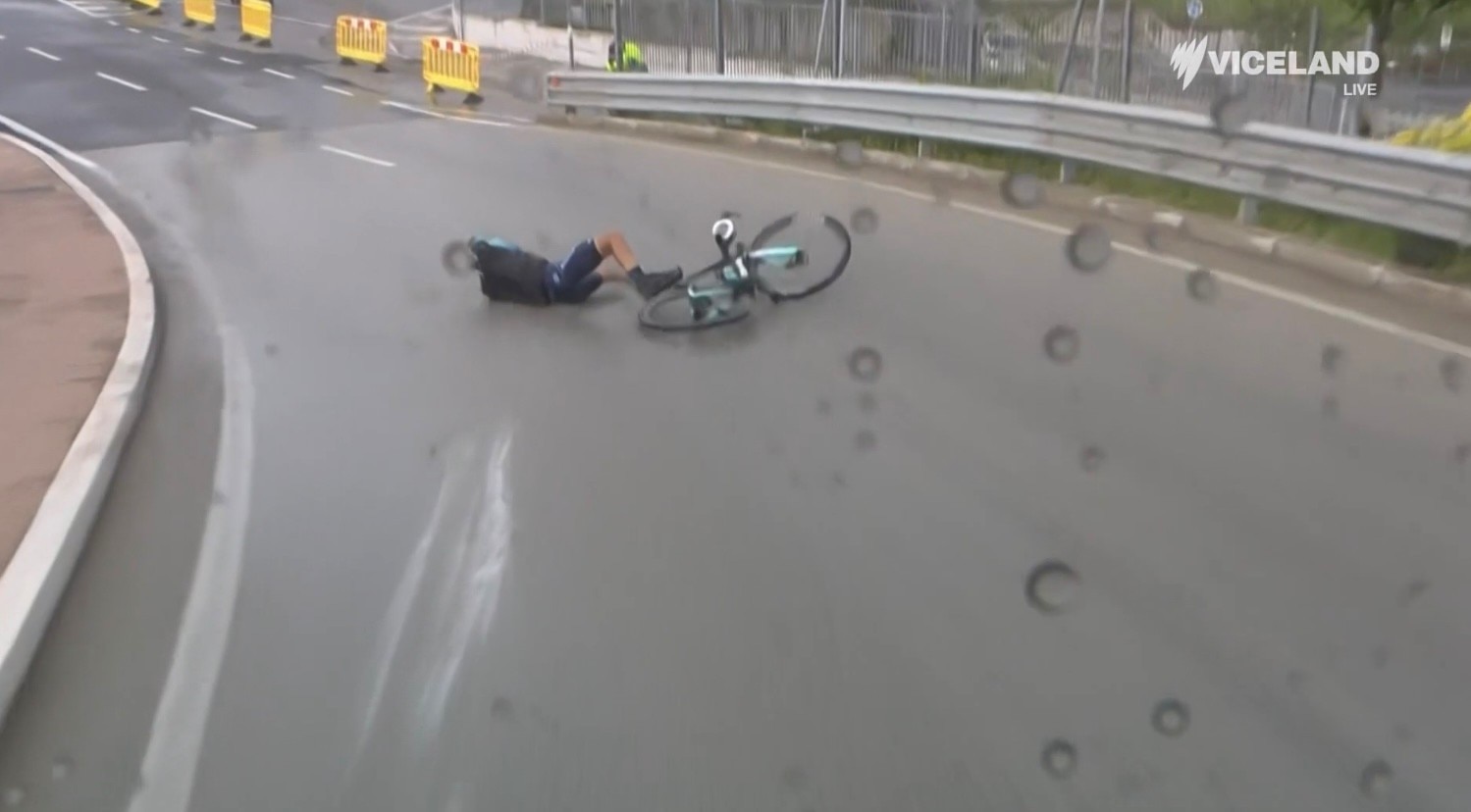 Afonso Eulálio slides off his bike in a cycling race