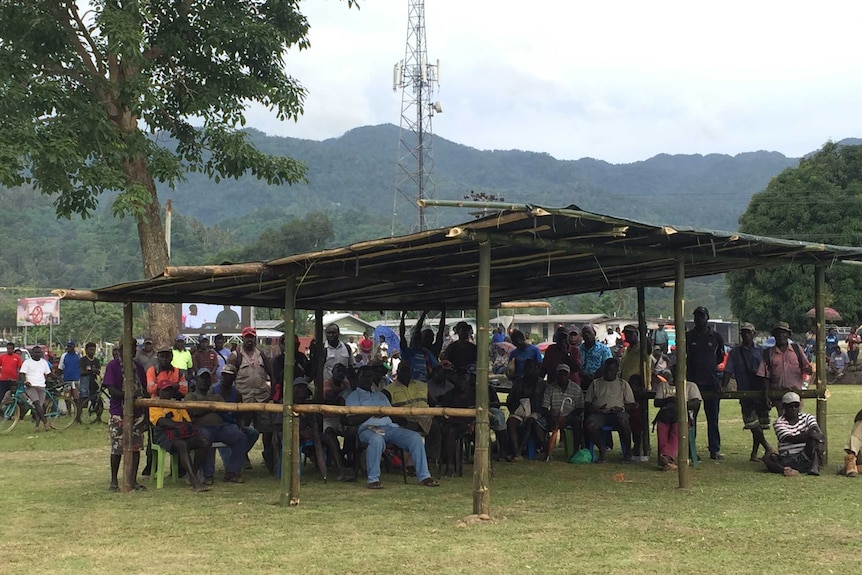 Bougainville residents attend a voter information event outside