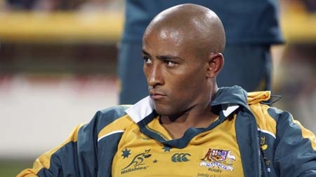 George Gregan watches from the bench as Australia loses to South Africa in Perth