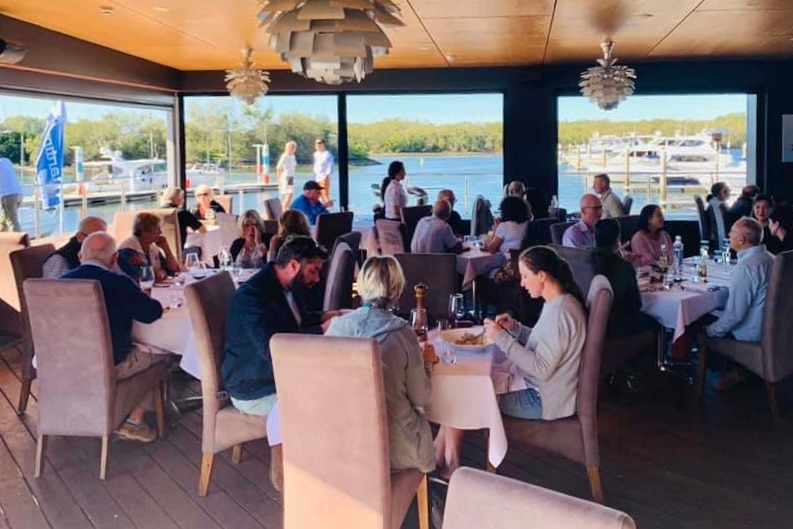 People dining in a fancy restaurant.