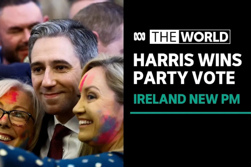 Harris Wins Party Vote, Ireland New PM: Man poses for a photo between two women who have paint on their faces.