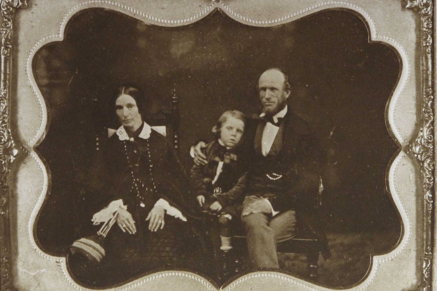 Turner family photo of two adults and a child.