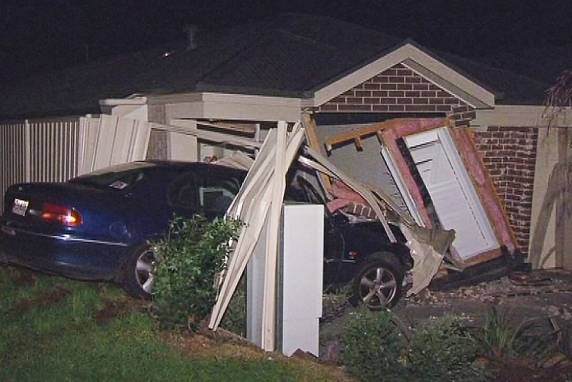 A car went through the front of a house