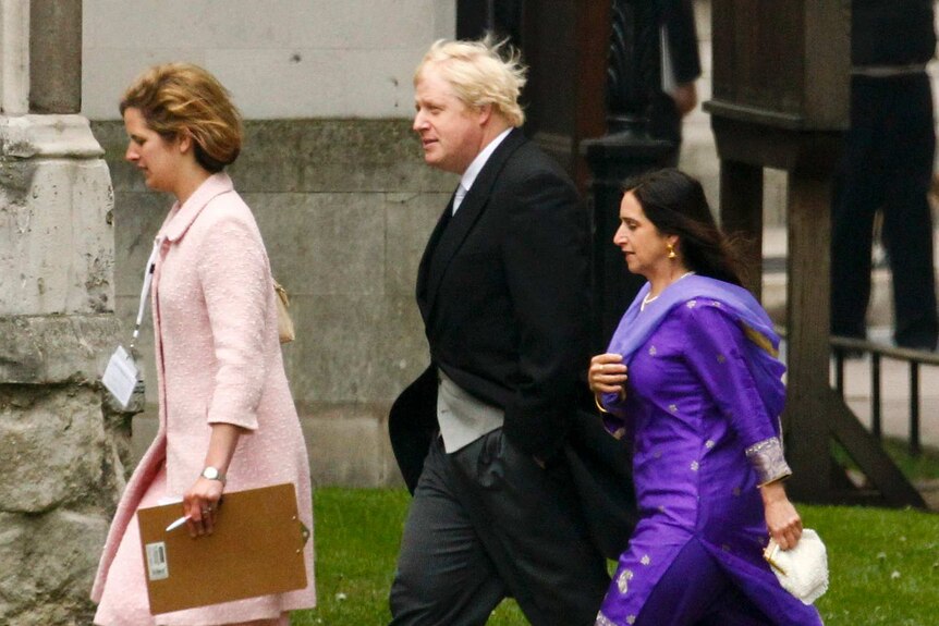 Boris Johnson in a suit walking to wedding