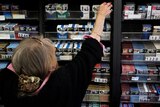 Cigarette companies will be forced to adopt no-frills packaging under new Federal Government laws.