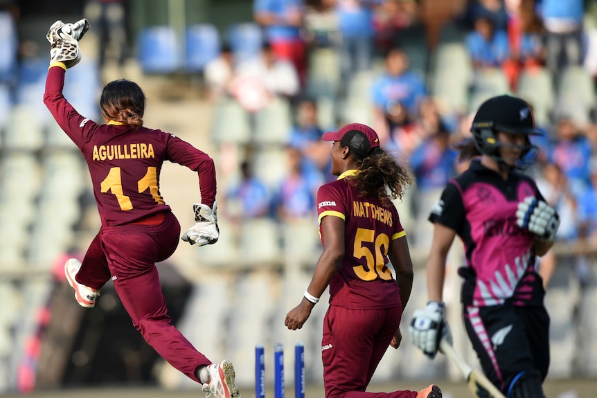 West Indies' Merissa Aguilleira (L) and Hayley Matthews celebrate World T20 win over New Zealand.