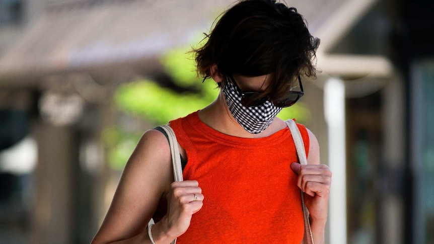 A woman wearing a mask to protect against coronavirus in Adelaide.