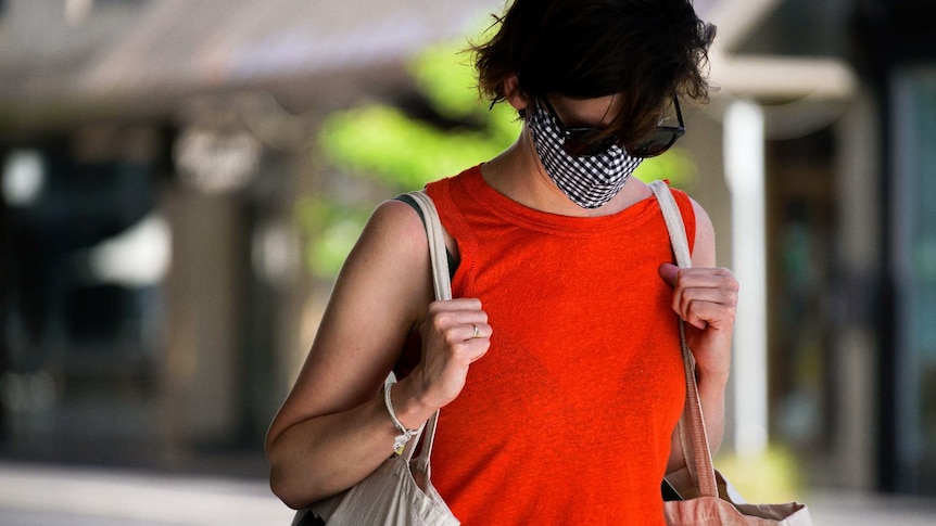 A woman wearing a mask to protect against coronavirus in Adelaide.
