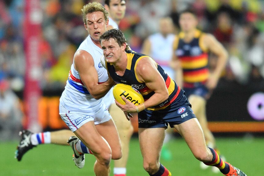 Adelaide's Matt Crouch (R) and Mitch Wallis of the Bulldogs in action at Adelaide Oval in July 2017.