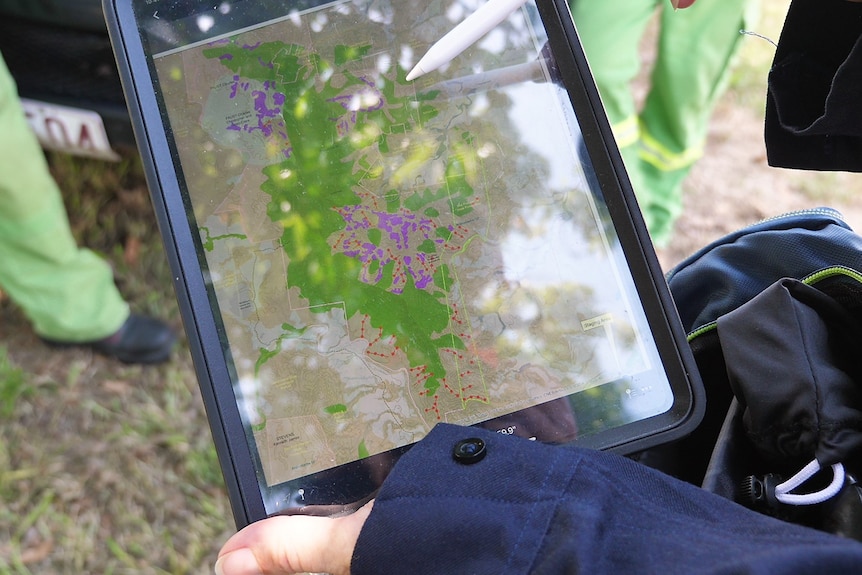 An ipad showing a colourful map of the area where incendiary devices will be dropped