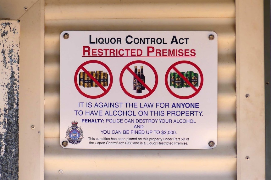 Close up of liquor control act sign on a house