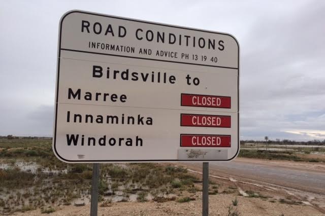 Road conditions sign showing closed roads.