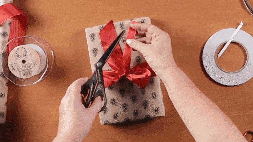 GIF of a ribbon being tied around a present