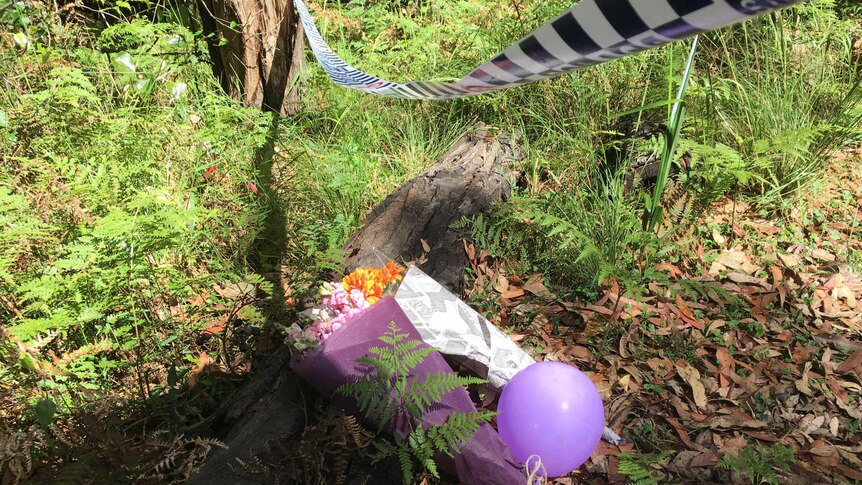 Flowers left at Matthew Leveson's search site.