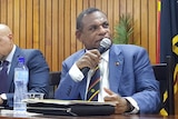 Papua New Guinea's Treasurer Patrick Pruaitch speaking at the Budget lock-up.