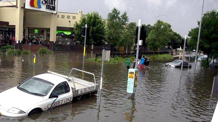 Floodwaters leave cars submerged along Forsyth Street in central Wagga Wagga